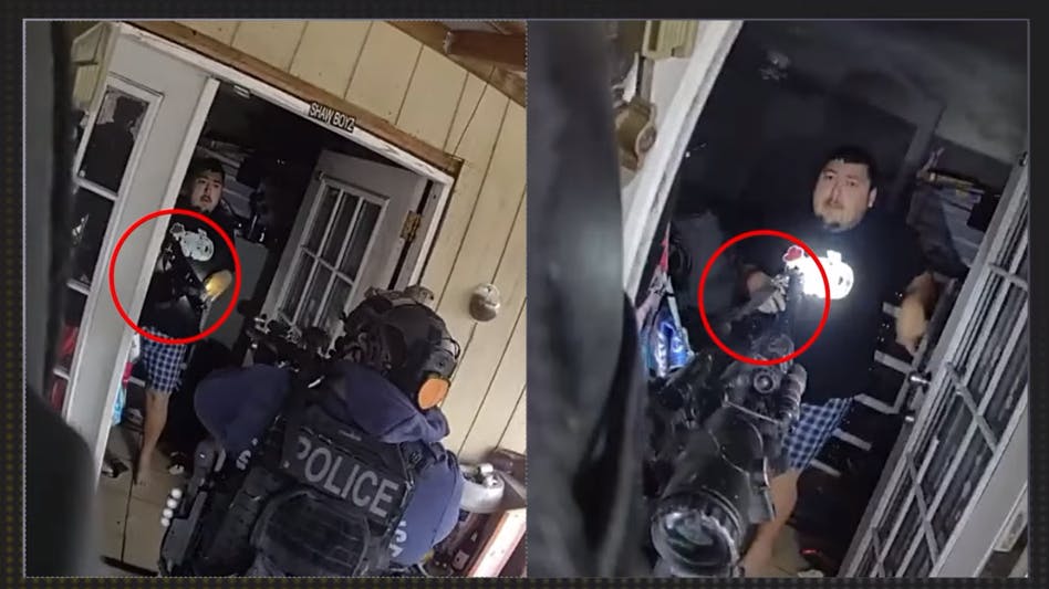 Suspect points gun at Dallas SWAT team.