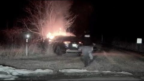Dramatic rescue of an unconscious driver inside a car engulfed in flames.