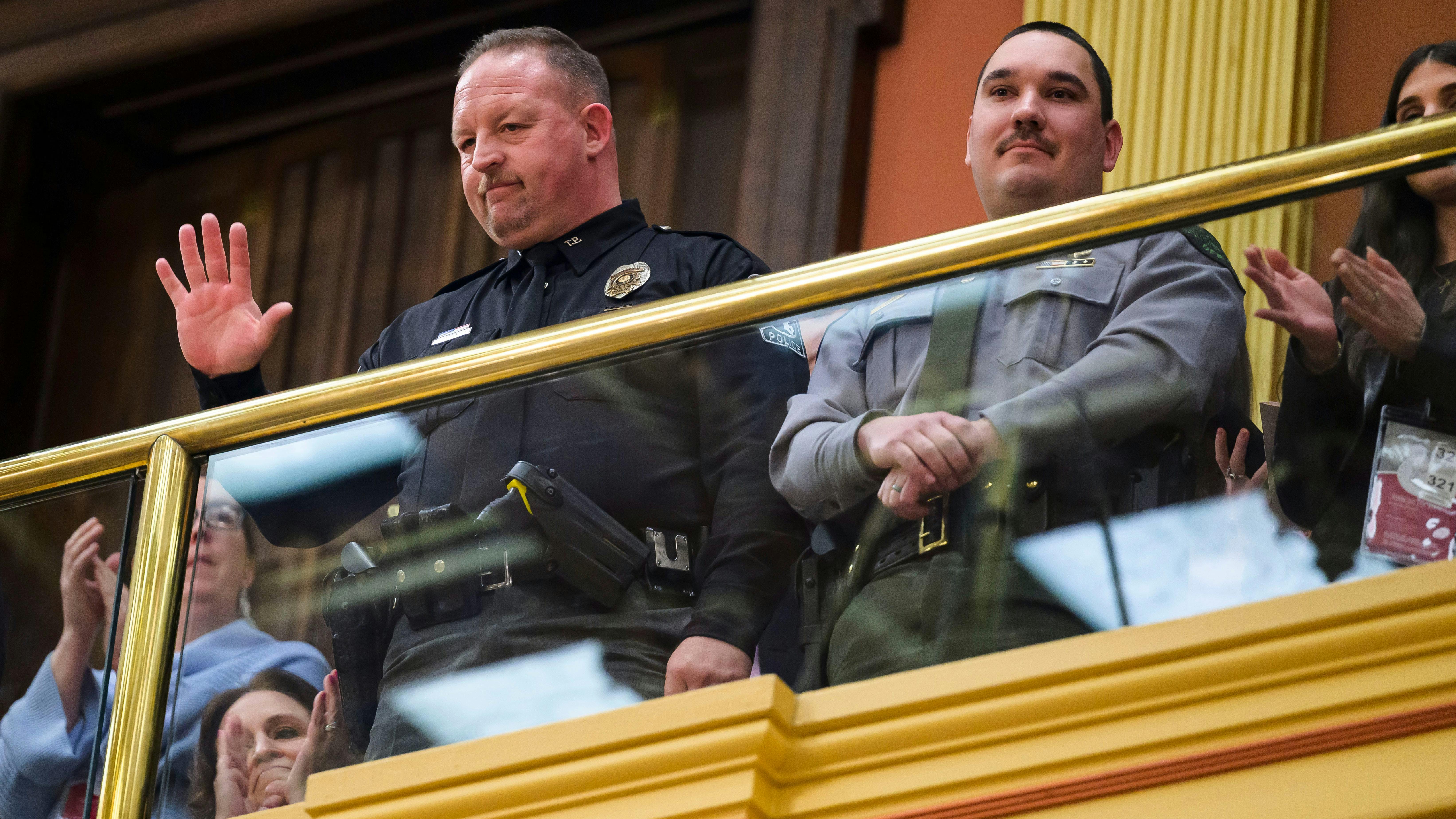 Grand Blanc Township, MI, Police Officer Jason Carpentier (left) and Department of Natural Resources conservation Officer Luke Robare.