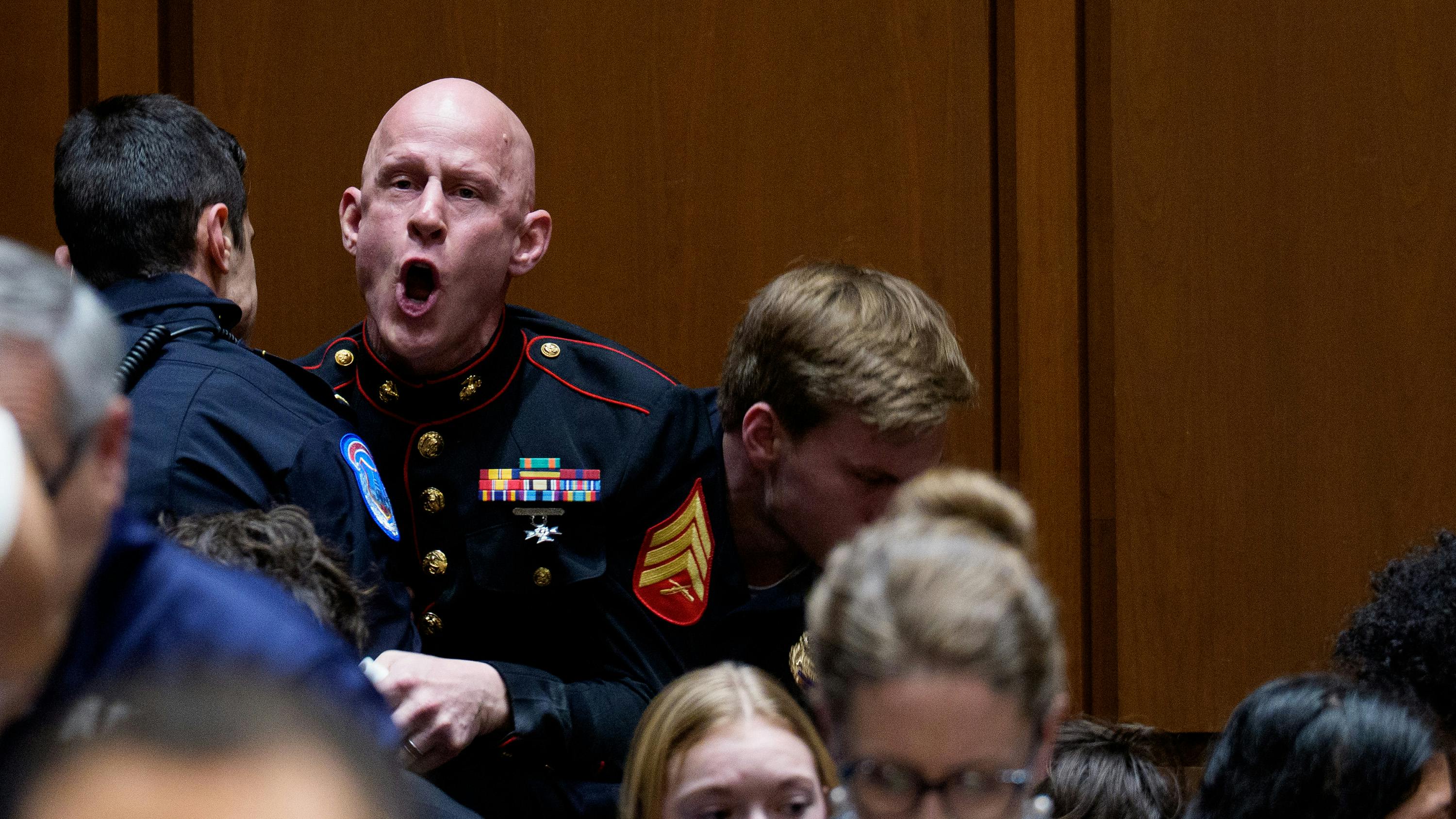 Protester Brian McGinnis disrupts a Senate hearing.