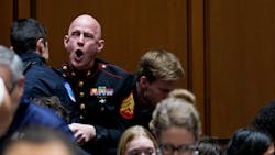 Protester Brian McGinnis disrupts a Senate hearing. Protester Brian McGinnis disrupts a Senate hearing.