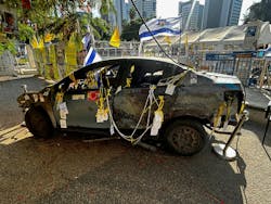 A burned vehicle struck by an RPG from Hamas during the October 7 attack. It is on display at Hostages Square in Tel Aviv. A burned vehicle struck by an RPG from Hamas during the October 7 attack. It is on display at Hostages Square in Tel Aviv.