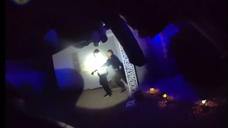 Phoenix police officer struggles with armed suspect.