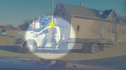 Milwaukee police officer hangs from fleeing truck's window