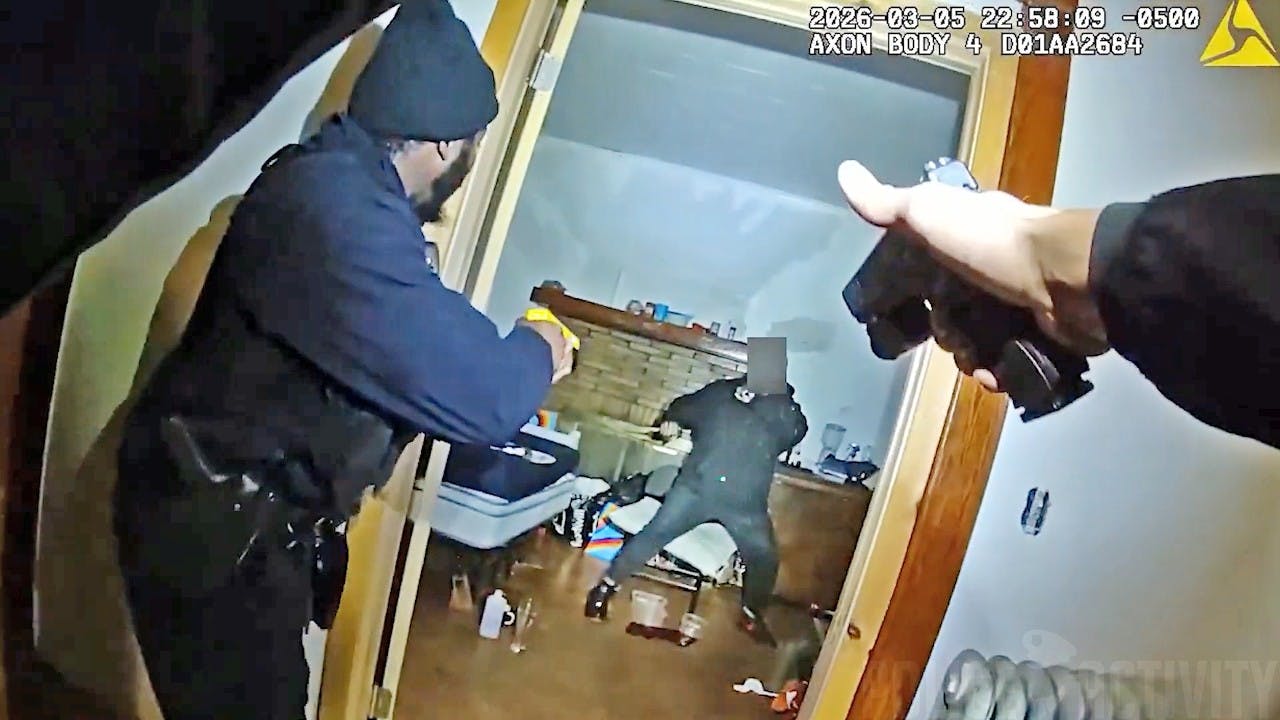 Buffalo, NY, police confront man armed with two knives.
