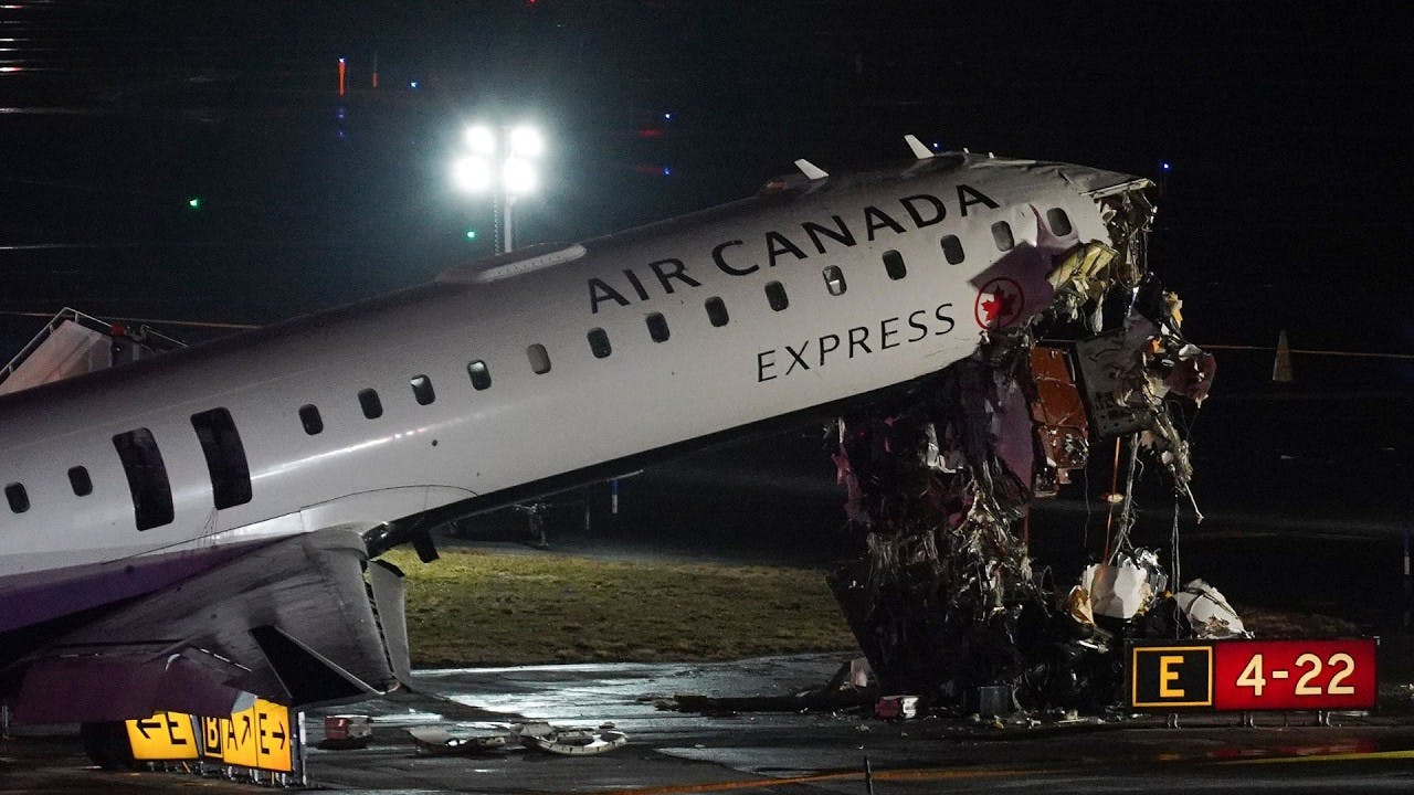 Air Canada jet crashes into fire truck at LaGuardia Airport in New York City.