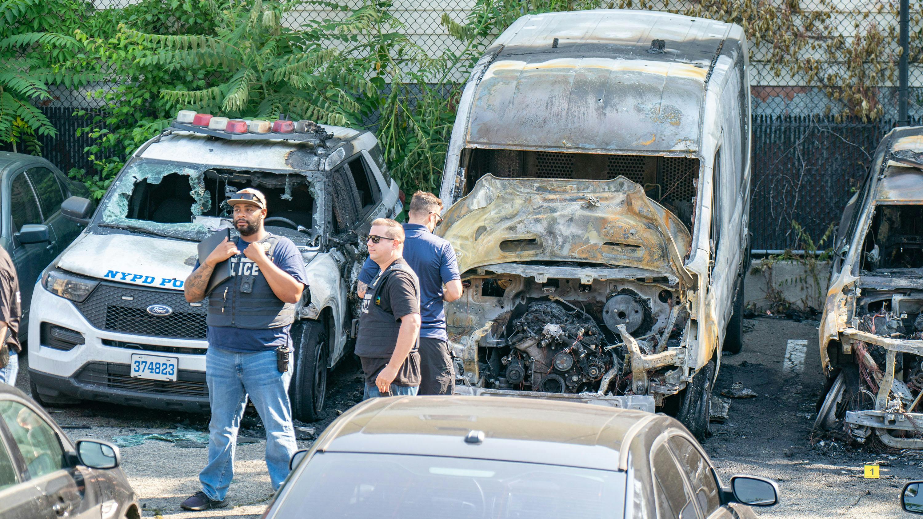 NYPD vehicles set on fire
