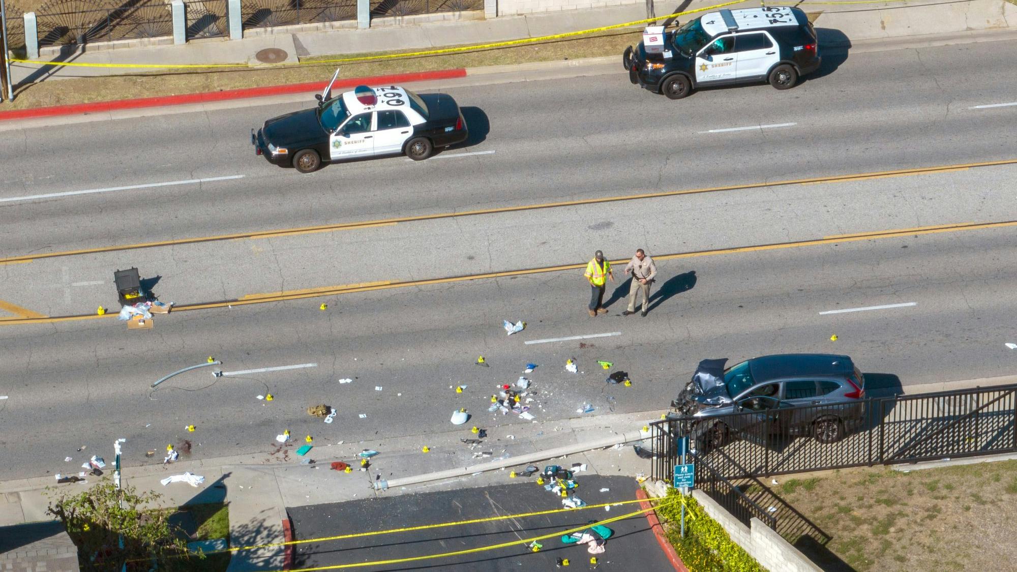 Investigators work the scene where 25 sheriff&rsquo;s and police recruits were hit by a driver in South Whittier on Nov. 16, 2022.