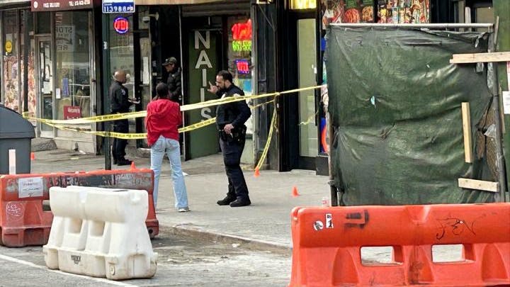 The NYPD is investigating a shooting Friday in Harlem that was interrupted by plainclothes officers on a break.