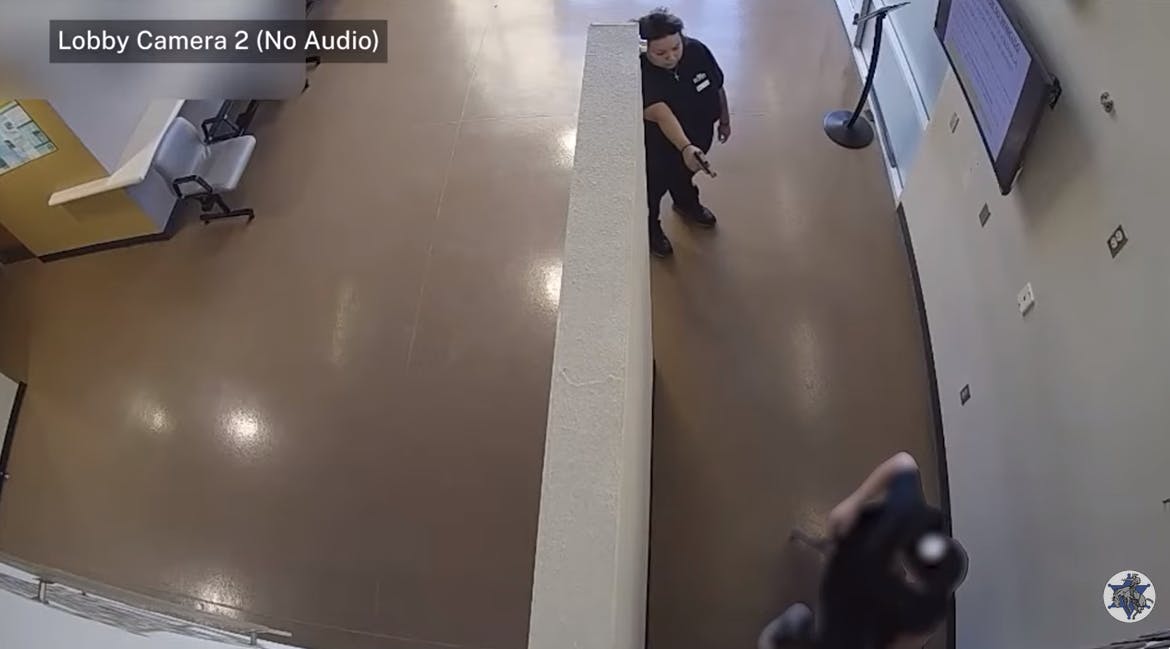 Woman points gun at civilian in Scottsdale police station