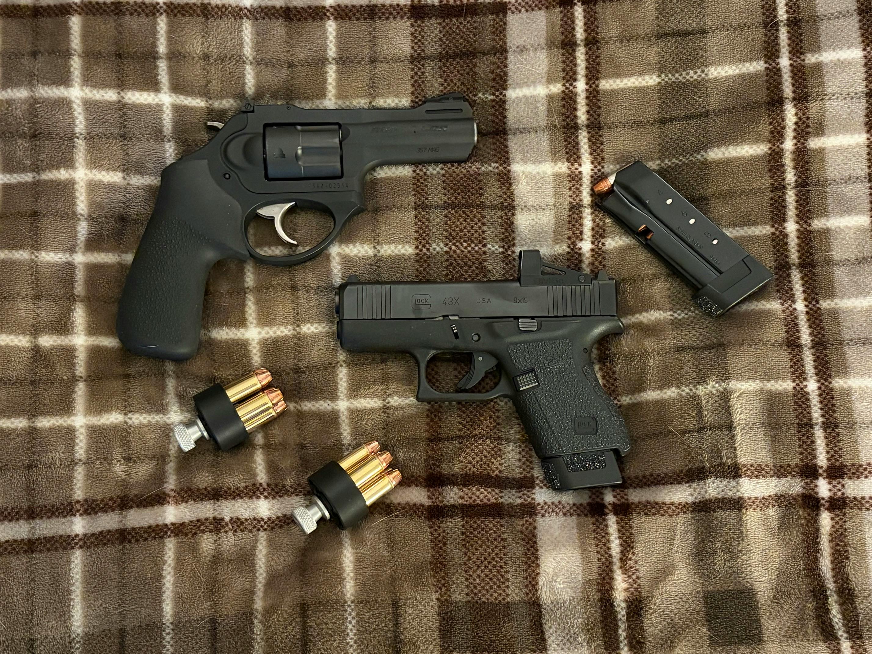 15 rounds of .357 Magnum or 19 rounds (10+the backup magazine) of 9mm? For EDC, the 9mm works. For backwoods predator protection, the .357 is better.