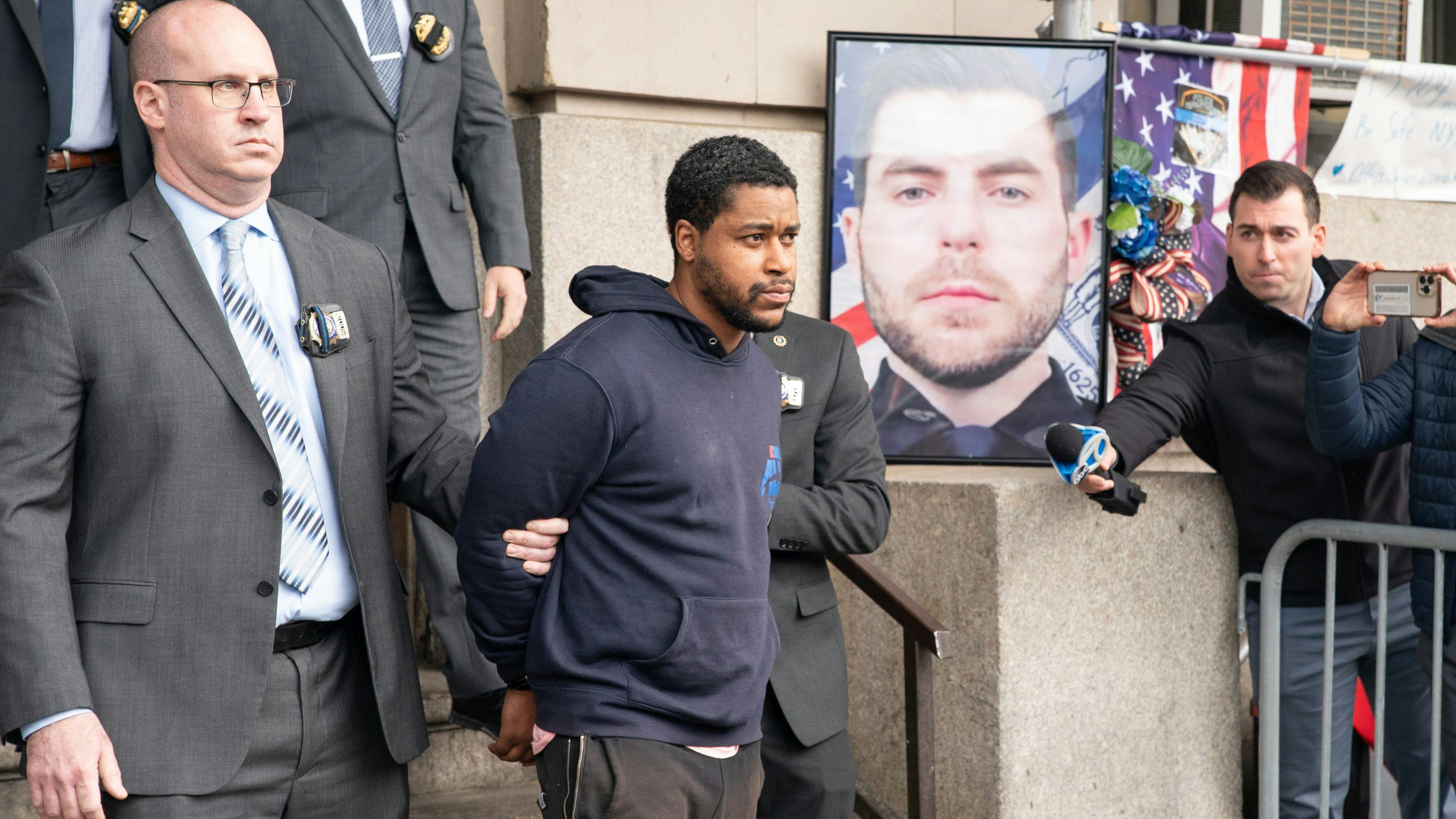 Lindy Jones is pictured in police custody leaving the NYPD 101st Precinct stationhouse on Wednesday, March 27, 2024 in Queens, New York.
