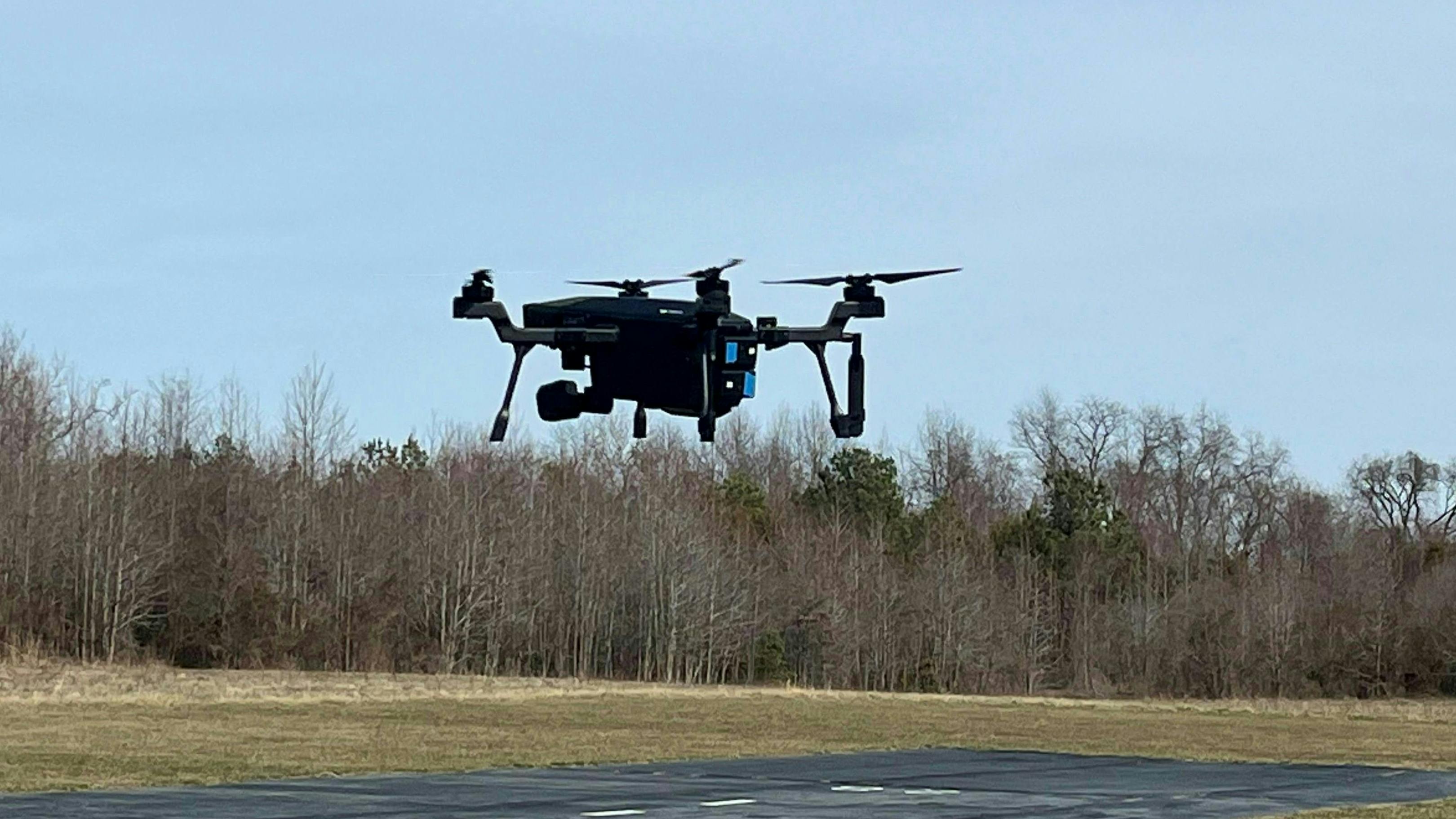 A SIRAS drone hovers in the air