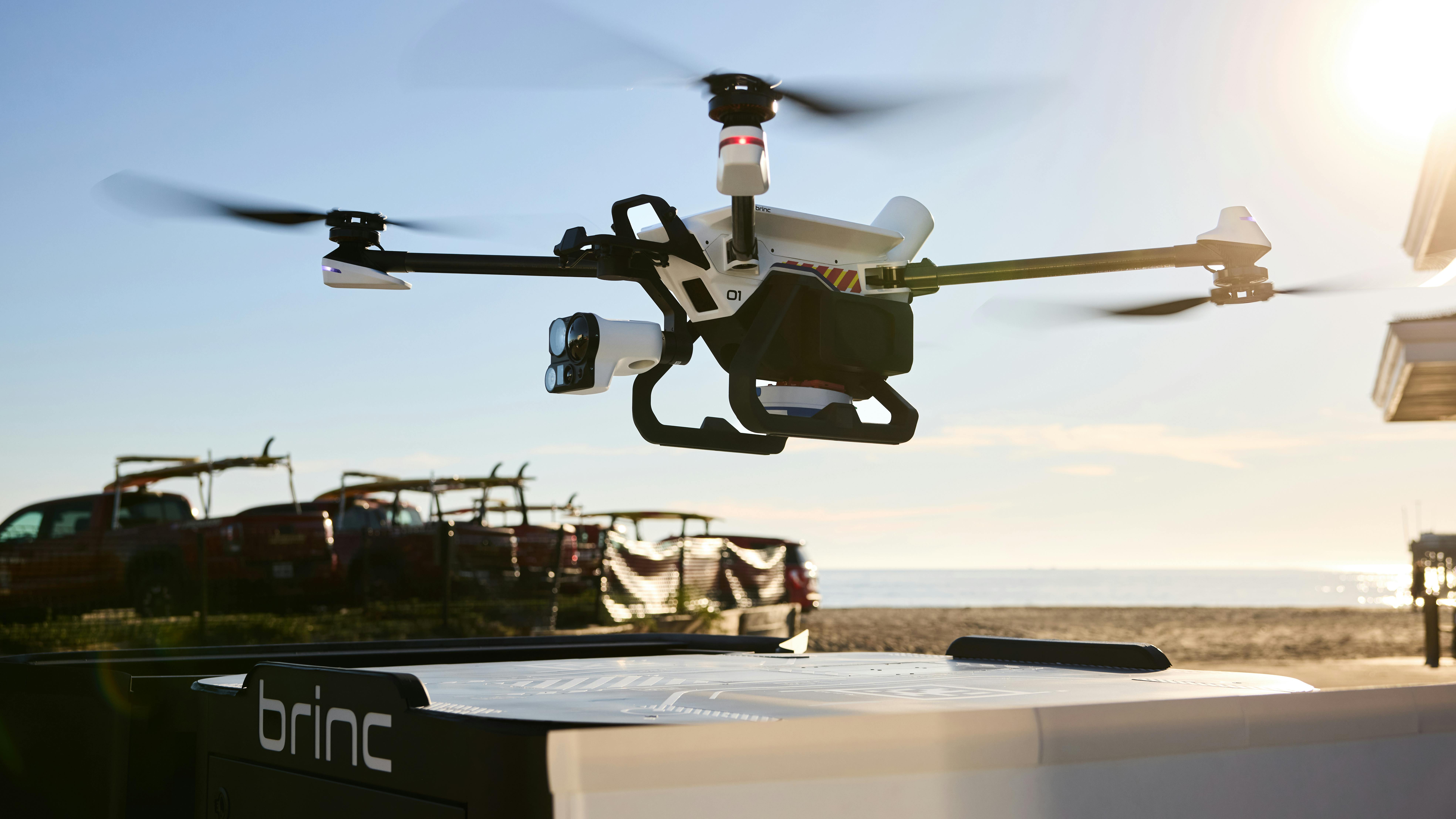 The BRINC Guardian Drone is seen being deployed from a docking station.
