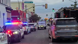 A Tucson police officer shot a suspected gunman early Sunday after authorities said the suspect opened fire in a crowded downtown area, wounding nine people before officers intervened.