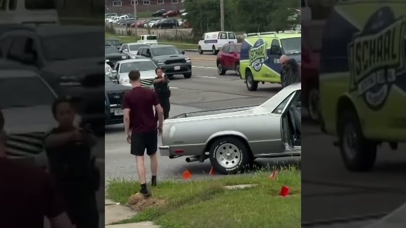Police Officer Pointing Gun at Teens in Car Accident