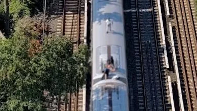NYPD drone keeps up with New York City subway surfers