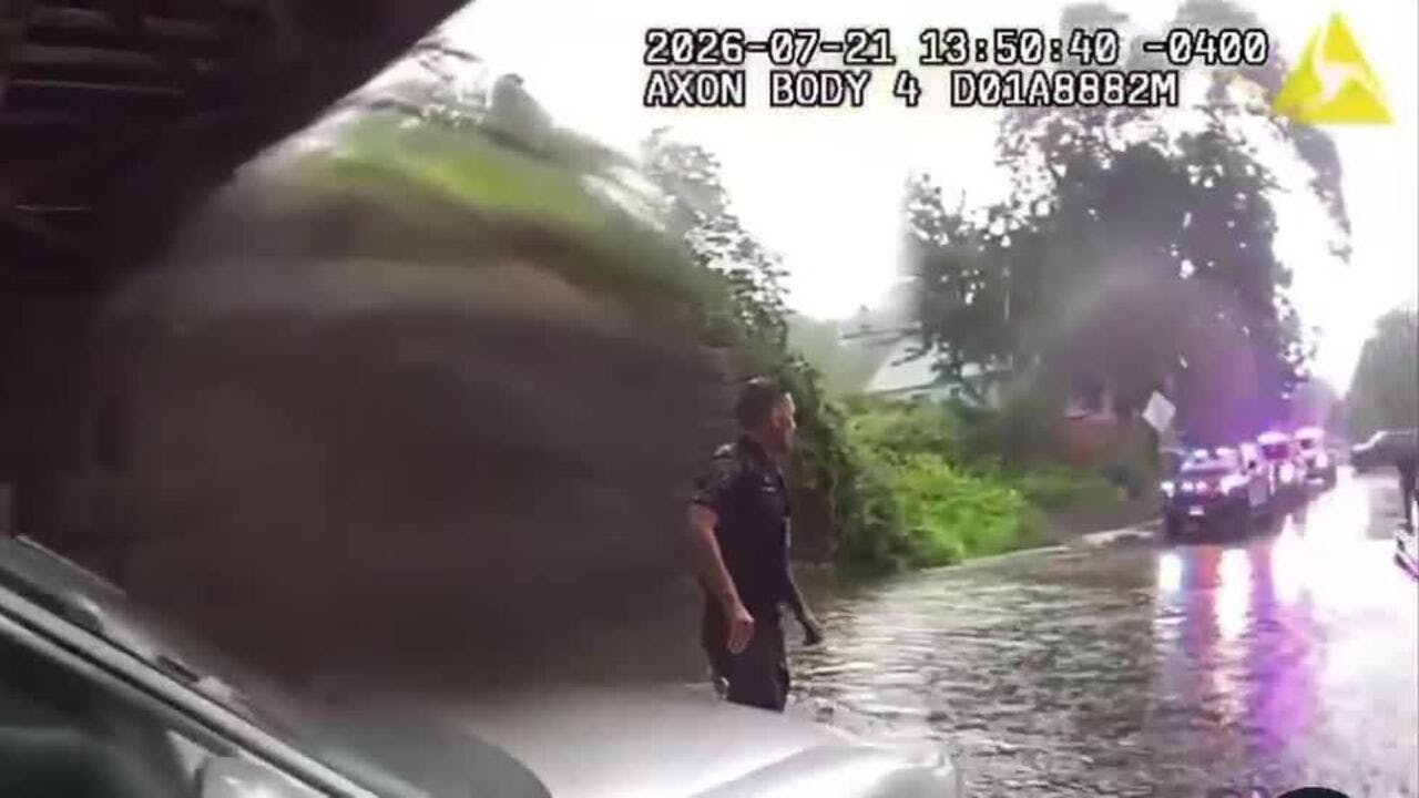 Milford police officer saves 2 trapped in car filling with water