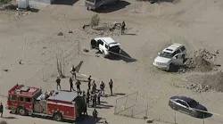 Investigators at the scene of a shooting involving a San Bernardino County sheriff's detective
