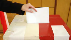 Voter casting ballot
