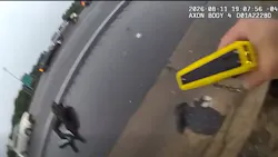 An Atlanta police officer runs across a busy interstate to apprehend a theft suspect