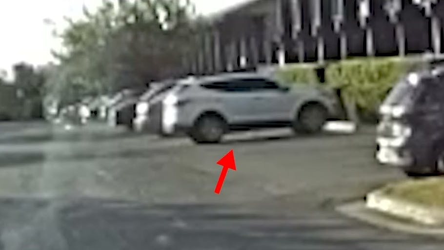 A suspect in an earlier assault opens fire from behind an SUV on an Austin police officer