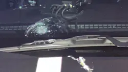 A Ramsey County deputy's windshield shows damage after a suspect's bullet struck it