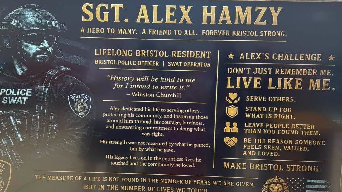 A plaque dedicating a middle school gym to fallen Bristol Police Sgt. Alex Hamzy