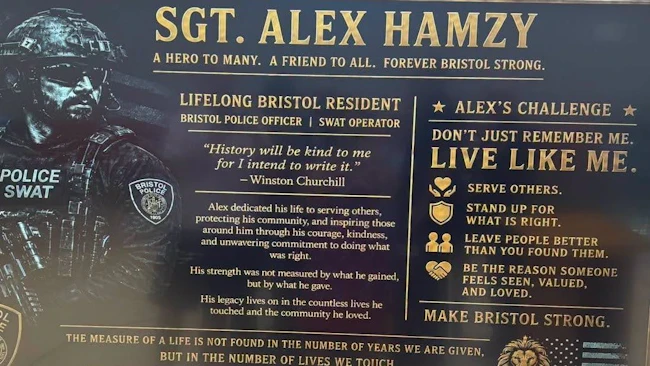 A plaque dedicating a middle school gym to fallen Bristol Police Sgt. Alex Hamzy
