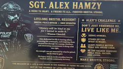 A plaque dedicating a middle school gym to fallen Bristol Police Sgt. Alex Hamzy
