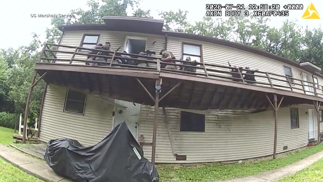 A porch collapses as a Moberly Area SWAT Team and U.S. marshals serve a high-risk warrant in Huntsville