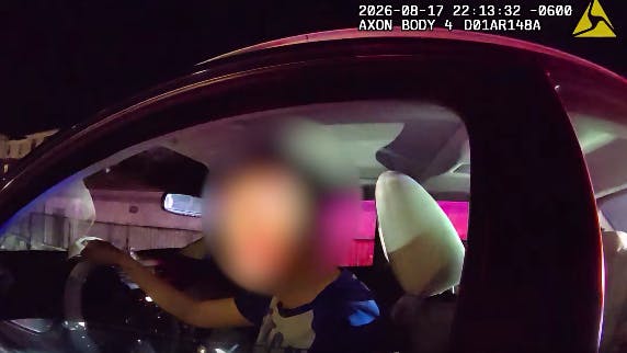 Paker police uses her body camera's translator to speak with a Mandarin-speaking driver during a traffic stop