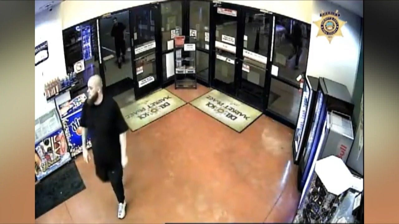 Security camera footage captures one of three suspects in connection with the killing of a Tucson police recruit