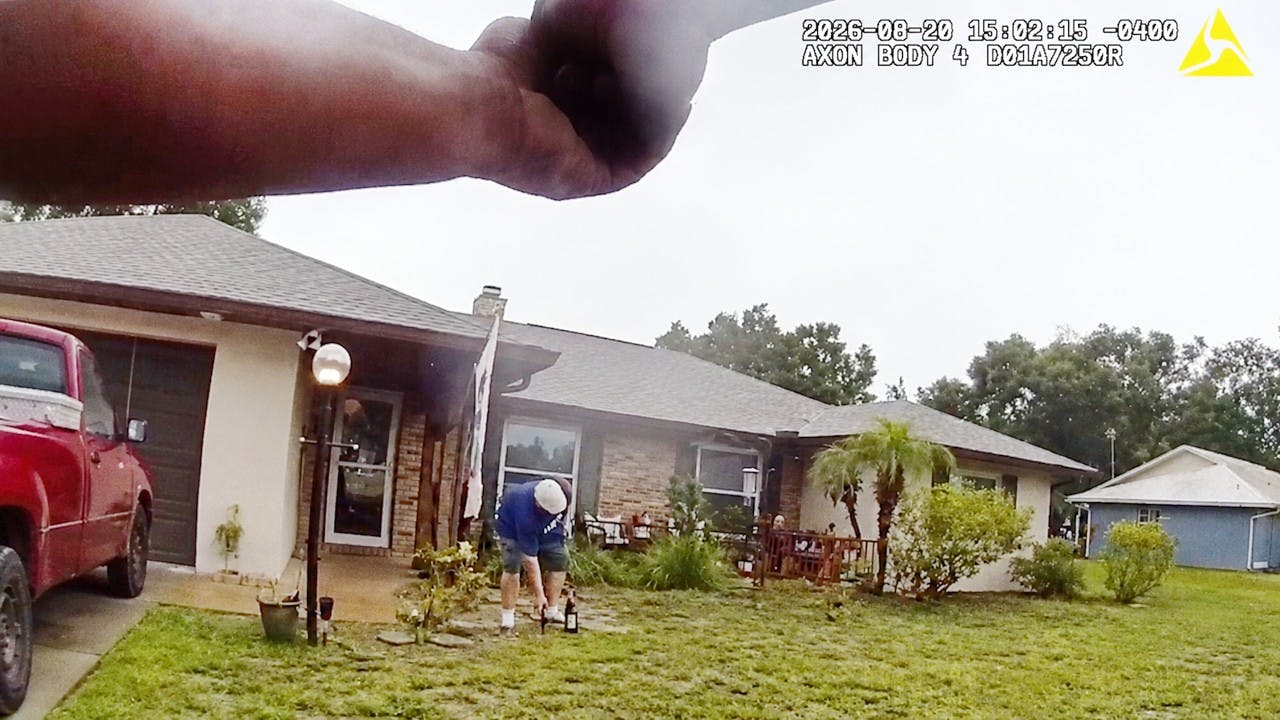 A 32-year-old suspect reaches for a gun on the ground in a confrontation with Lake County deputies