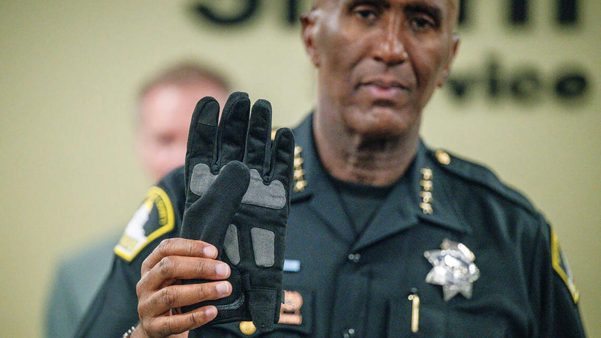 Sacramento County Sheriff Jim Cooper holds electric shock glove
