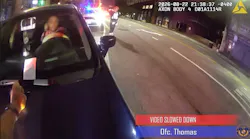 Baltimore police officer lands on a car hood after he was struck by a fleeing suspect