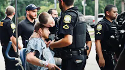 Wounded Columbia Police Officer David Dymock receives a hug from a colleague after he's released from the hospital