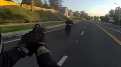 A Corona police officer with his gun drawn backs away as a suspect accused of attacking an elderly woman with a rock advances with a knife