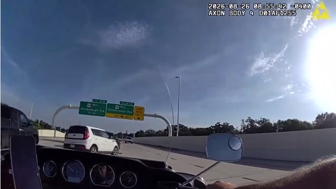 Vehicle swerves in front of Tampa police motorcycle officer before rear-ending pickup truck