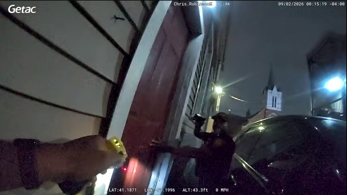 Bridgeport police confront an armed suspect in a doorway