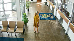 A woman with a handgun enters the lobby of a Port Orange police station