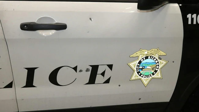 Bulletholes on a Richmond police cruiser