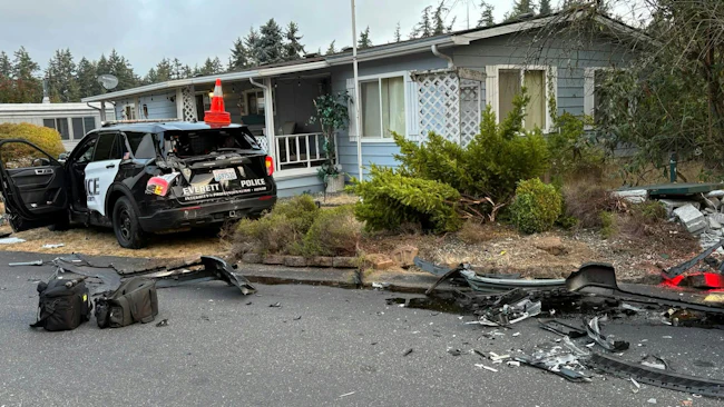 A wrecked Everett police cruiser after a stolen semi rammed it