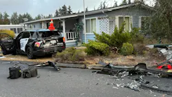 A wrecked Everett police cruiser after a stolen semi rammed it
