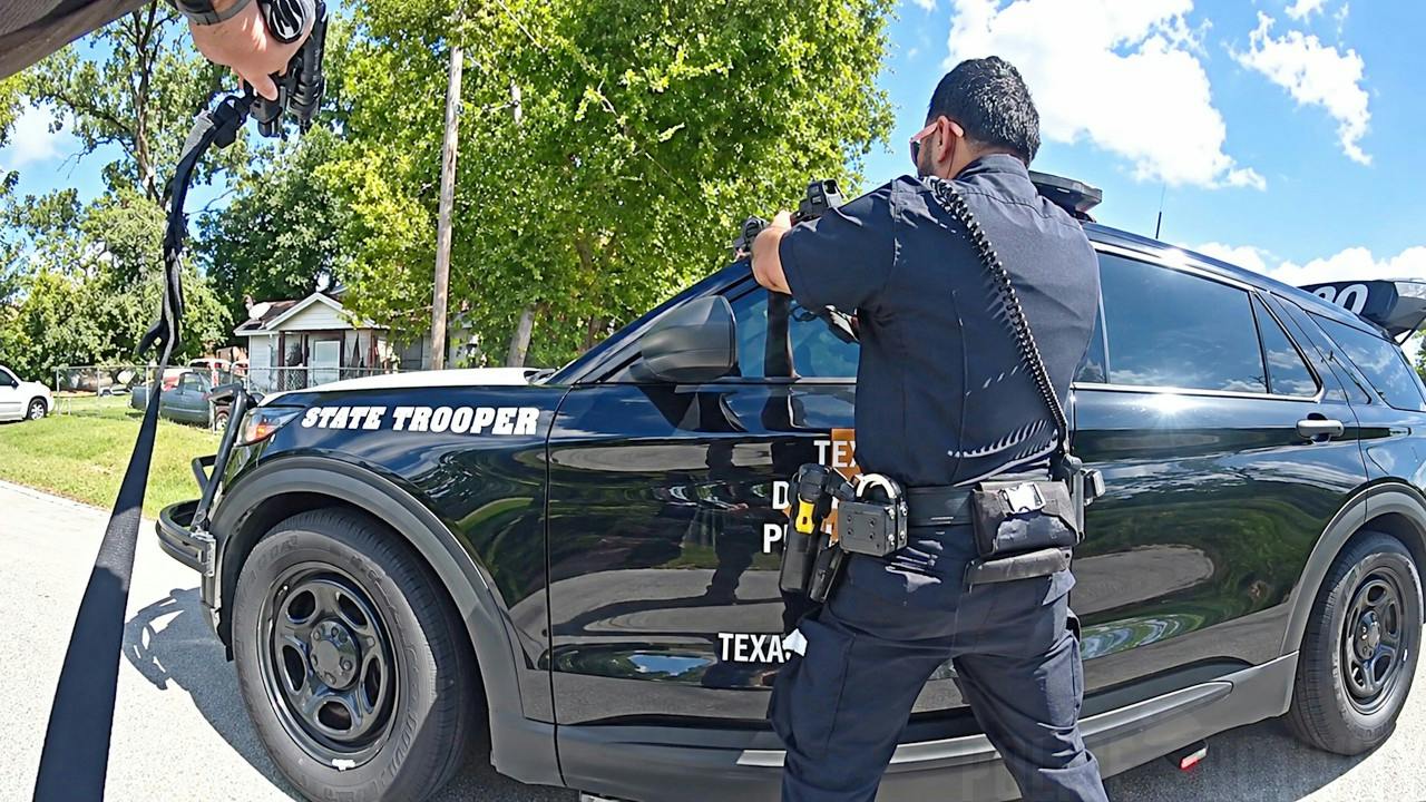 Houston police and a Texas trooper confront a man with a rifle accused of firing on passing vehicles
