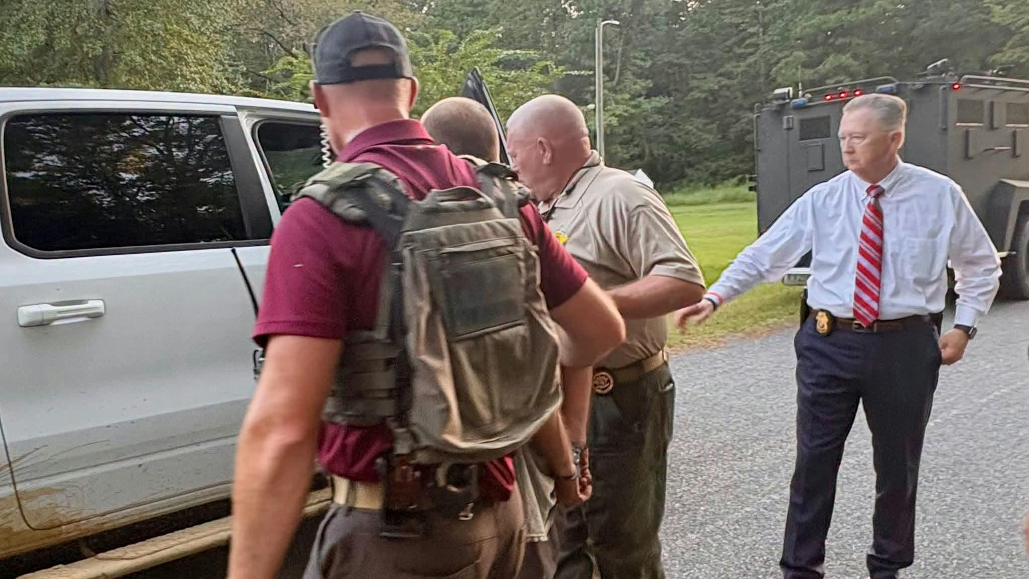 A suspect is apprehended in the shooting of a Columbus County deputy