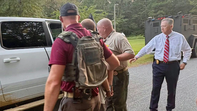 A suspect is apprehended in the shooting of a Columbus County deputy