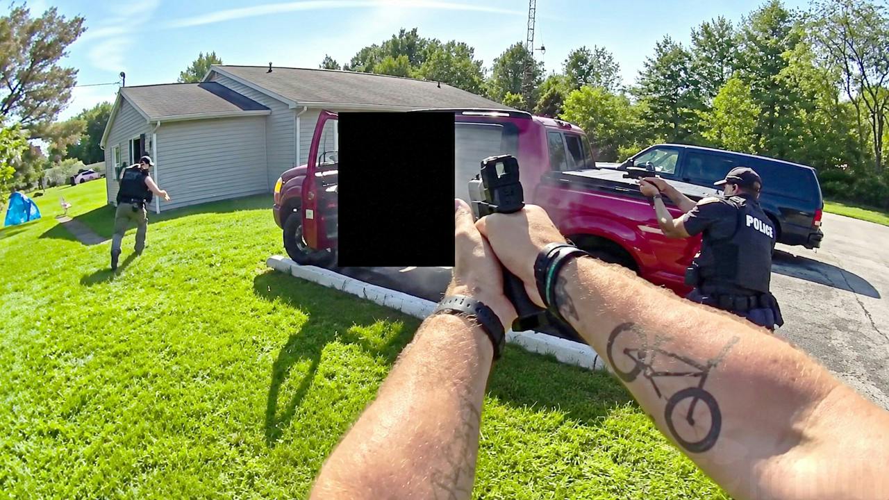 Alliance police officers confront armed suspect