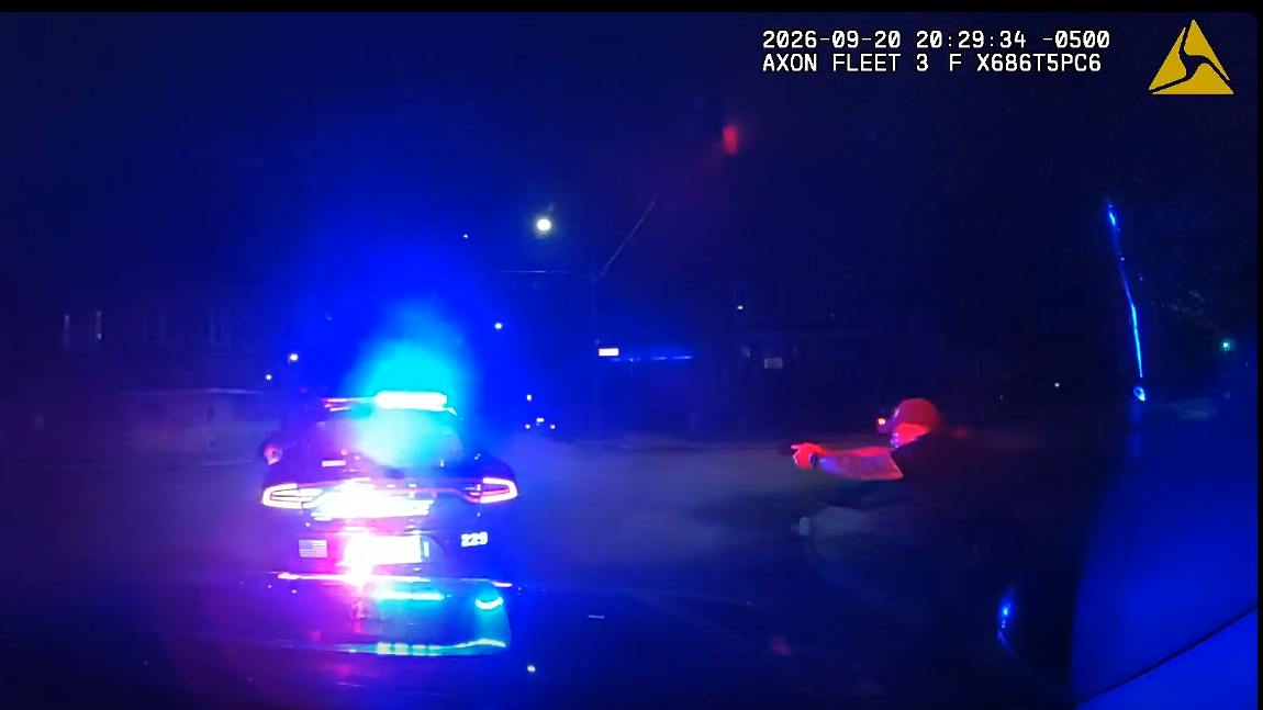 A Kenosha police officer returns fire after a homicide suspect began shooting