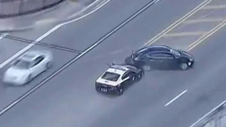 Florida Highway Patrol trooper executes a PIT manuever to stop a suspect who carjacked a vehicle
